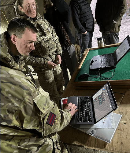 Engineers using the tool on laptops during live field testing